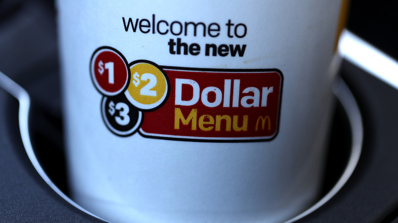 A coffee cup advertising the $1, $2, $3 menu