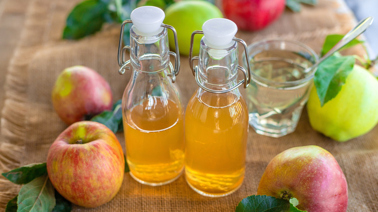 Apple cider vinegar is stored in glass bottles