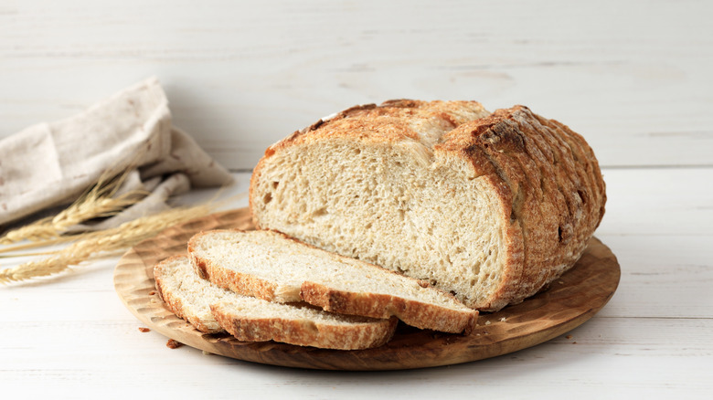 Sliced sourdough bread on a wooden board