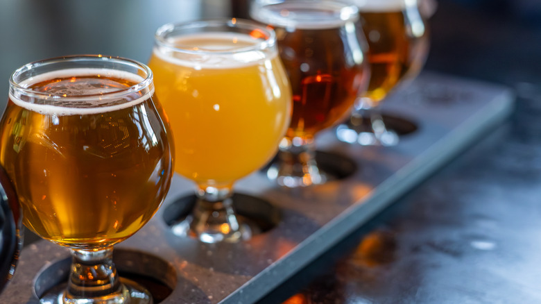 Craft beers served together on a sampler tray.
