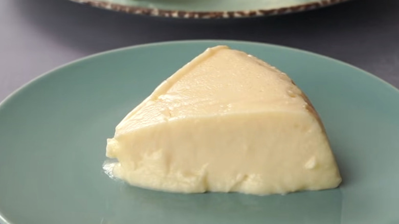 the cheesecake sitting on a green plate