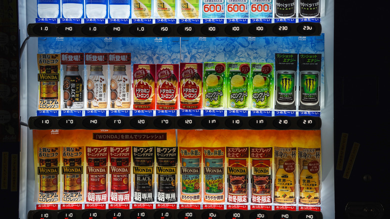 A Japanese vending machine with coffees, juices, and energy drinks