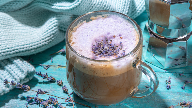 A creamy Raf coffee topped with foam and fresh lavender