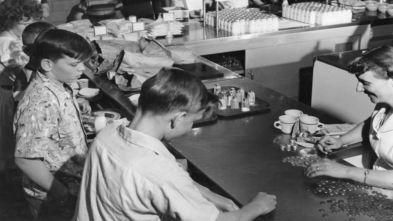 Students line up to get lunch in the cafeteria in the late 1940s