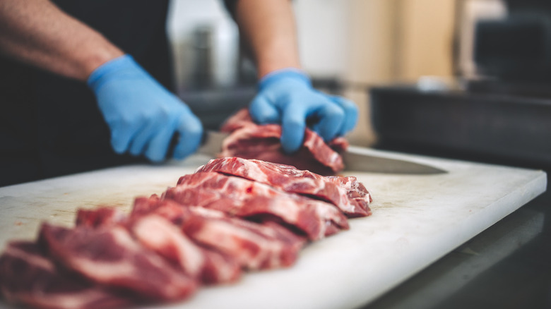 Man cutting steak