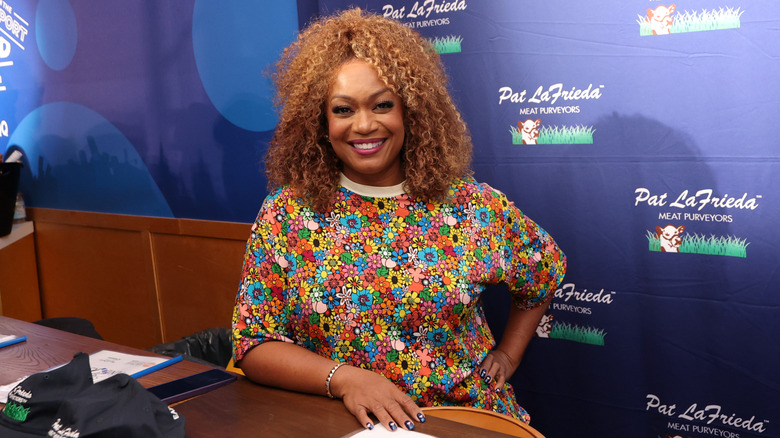 Sunny Anderson smiles at the Blue Moon Burger Bash 2.0 presented by Pat LaFrieda Meats hosted by Brooklyn Beckham and Rachael Ray hosted by Food Network New York City Wine & Food Festival presented by Invesco QQQ