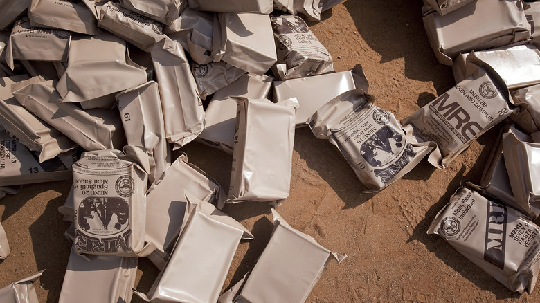 Various packages of MREs on the ground