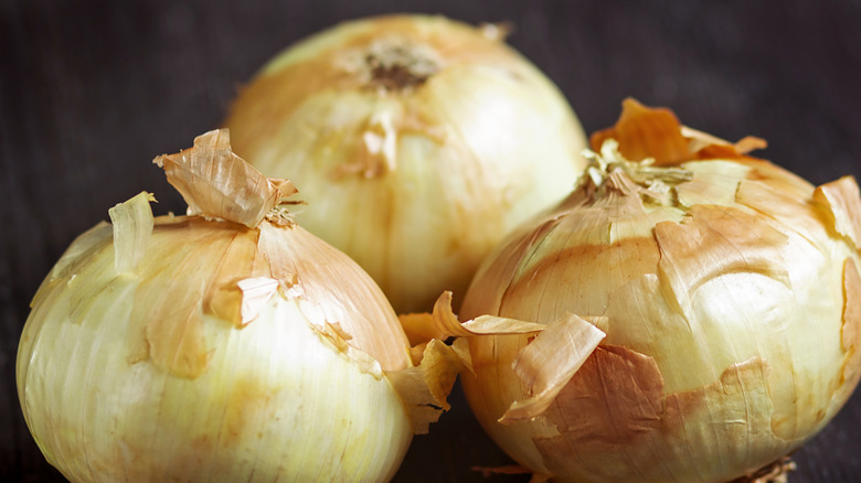 three rustic-looking Bermuda onions