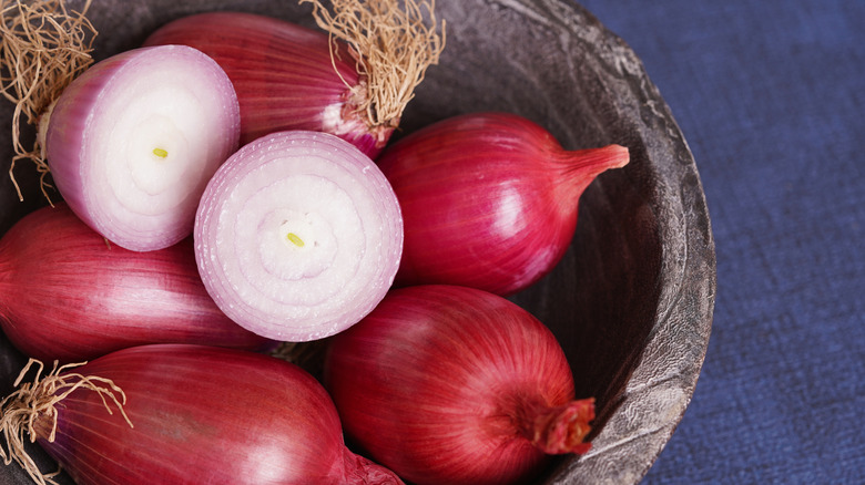 whole and halved torpedo onions in a bowl