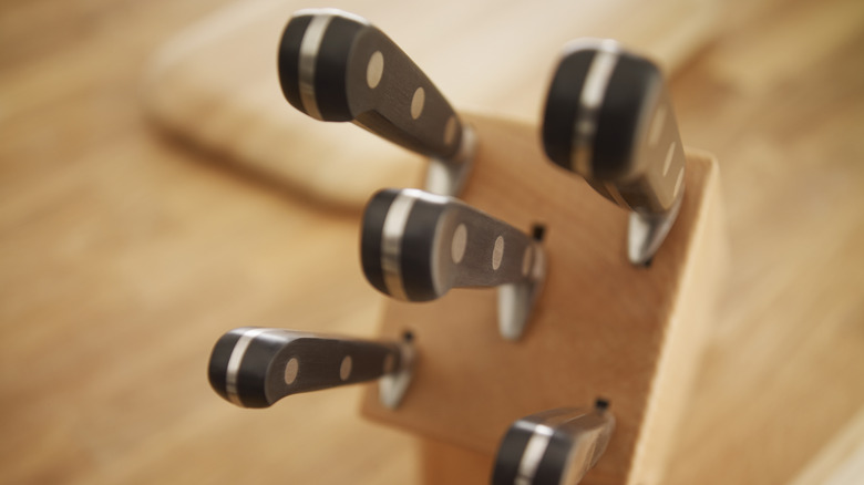 Knives stored in a wooden knife block