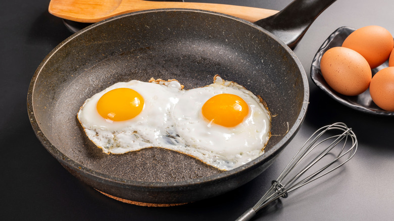 Two fried eggs in a pan