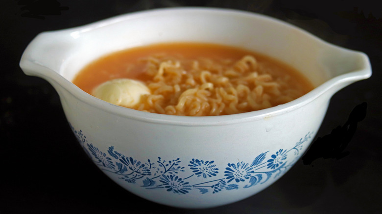 An old-fashioned Pyrex that's white and printed with blue floral shapes