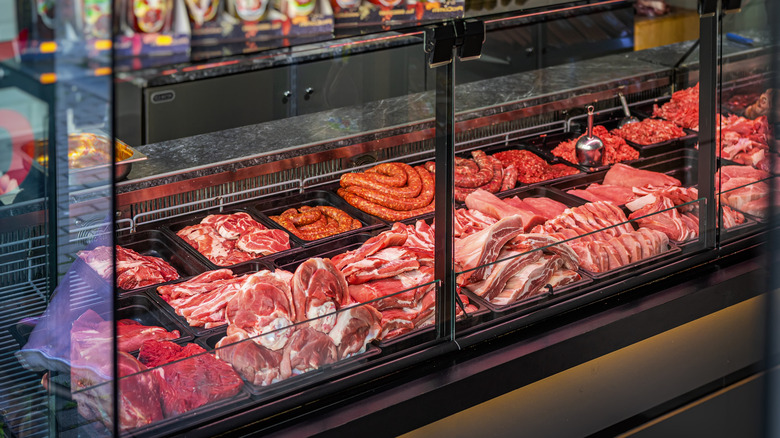 Different cuts of meat displayed at a butcher shop