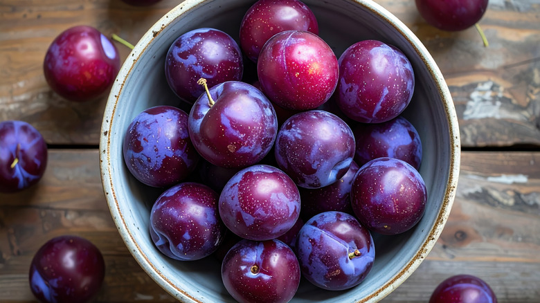 Bowl of purple plums