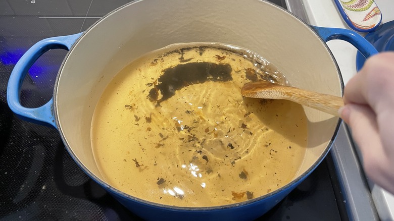 Scraping stains with wooden spoon