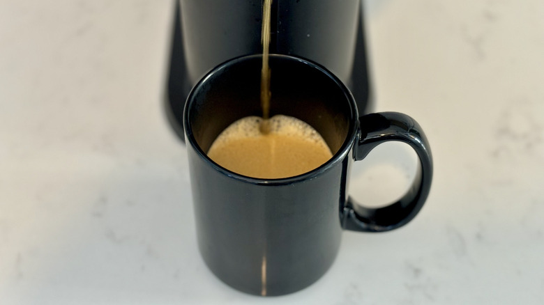 Coffee being poured into mug