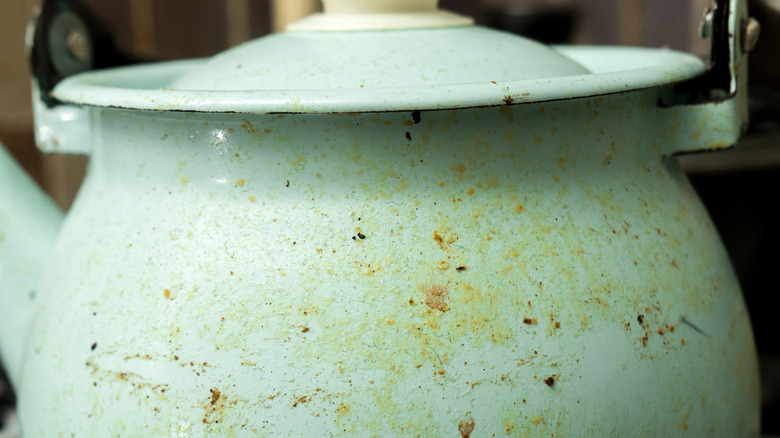 A closeup of a dirty vintage kettle.