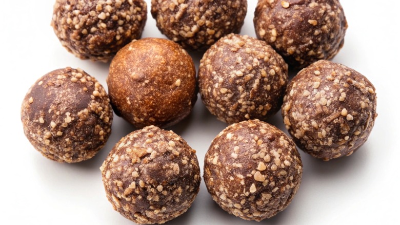 Nine bourbon balls on a white background
