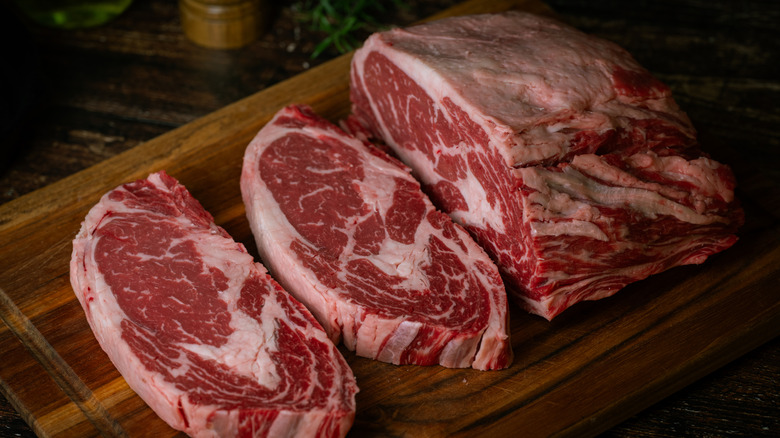 a ribeye partially cut into ribeye steaks