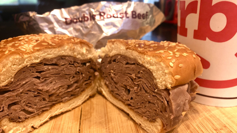 An Arby's Double Roast Beef sandwich and a soda