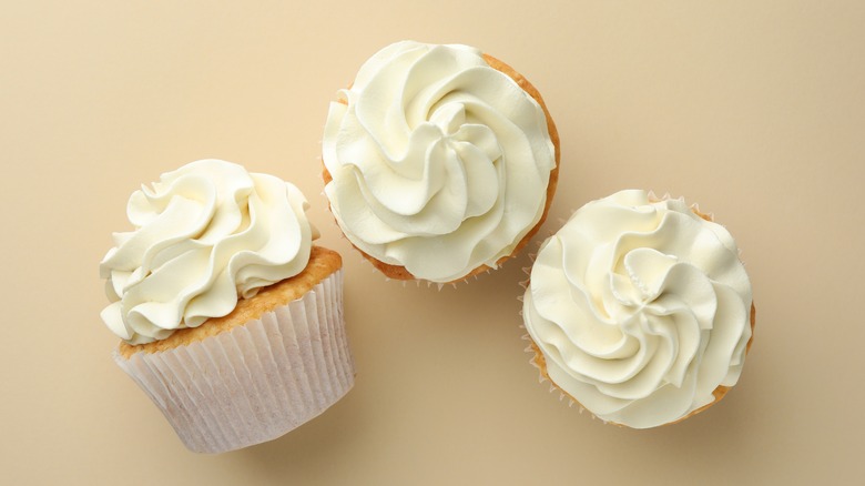 Three plain vanilla cupcakes