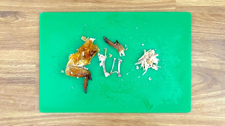 Deboning the wing of a rotisserie chicken by hand