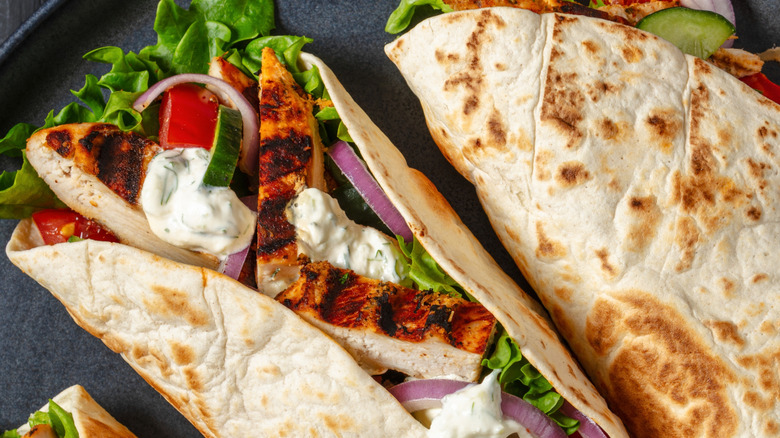 Chicken tacos on a black plate