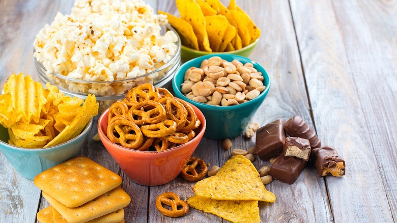 Colorful bowls of sweet and salty snacks