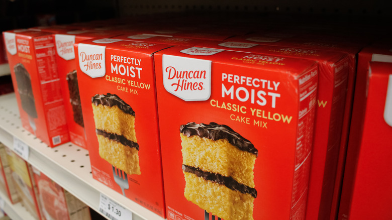 Duncan Hines yellow cake mix on a store shelf