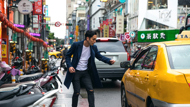 Man getting into cab