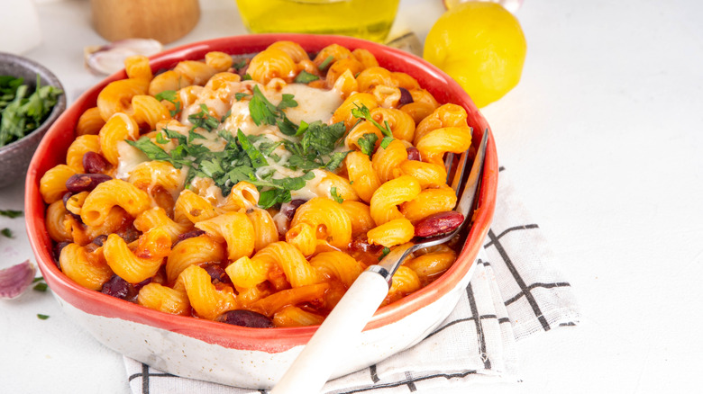 A bowl of macaroni and cheese with chili mixed in