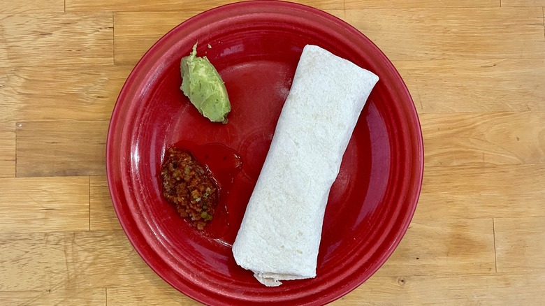 Burrito on red plate