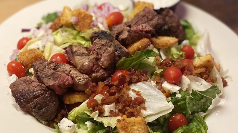 Texas Roadhouse steak salad with bacon bits