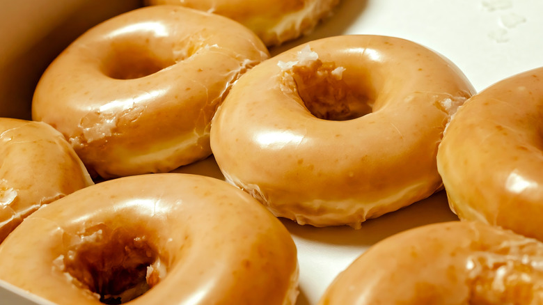 Close-up of an open box of Krispy Kreme doughnuts