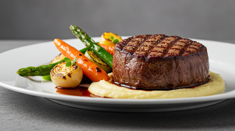 Filet with grill marks, vegetables