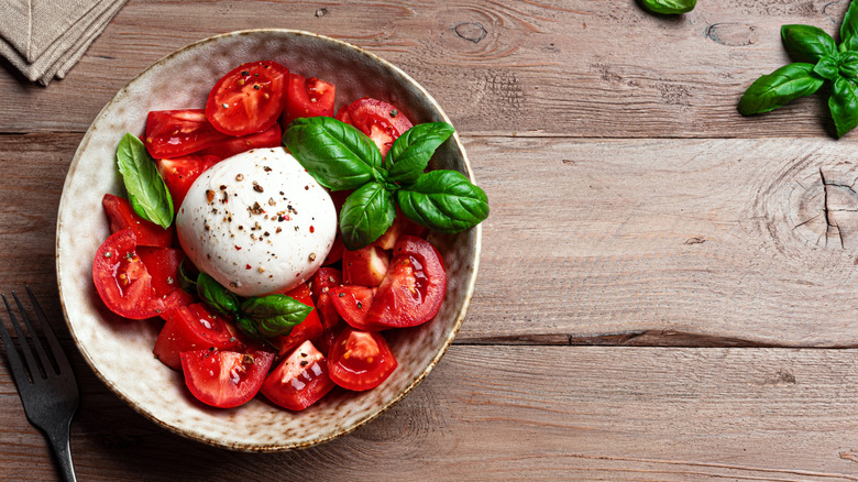 Burrata in a bowl with tomatoes