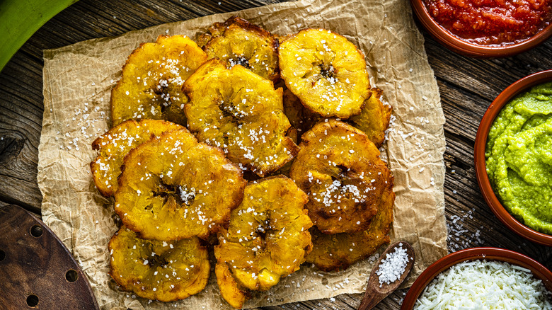 fried plantains with salt on brown parchment paper