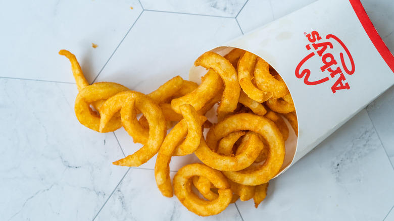 Container of Arby's curly fries