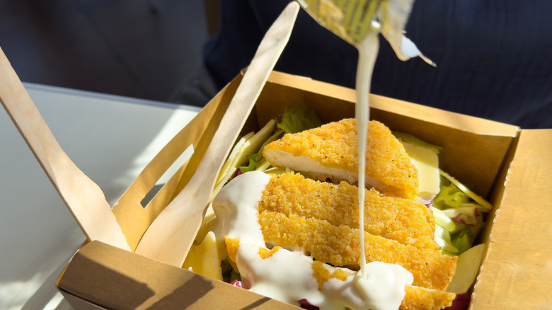 Chicken salad in cardboard box.