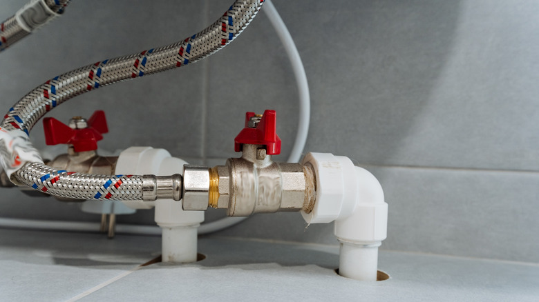 water shutoff valves under a kitchen sink