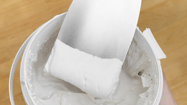 white putty in a bucket