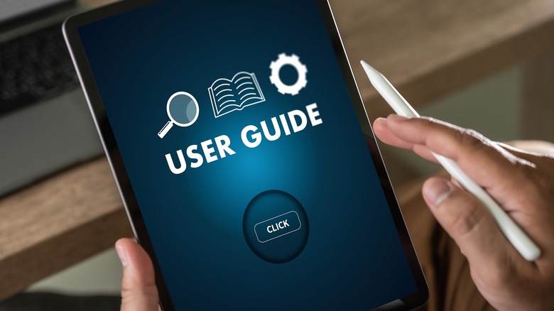 hands holding nonspecific user guide