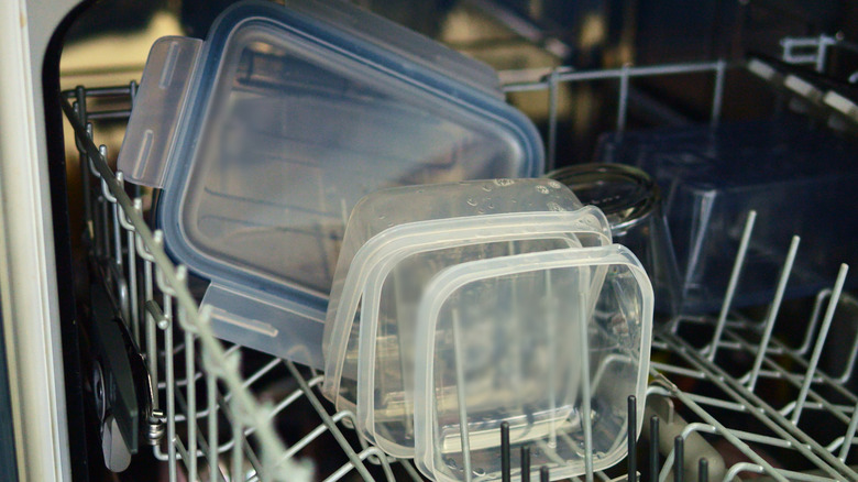 Plastic containers on a dishwasher's top rack