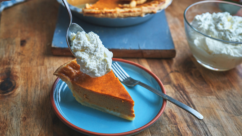 Whipped cream on pumpkin pie