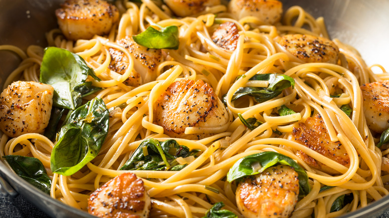 Scallops pasta dish with greens