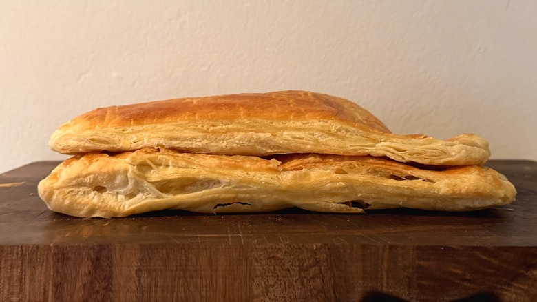 baked puff pastry dough resting on cutting board