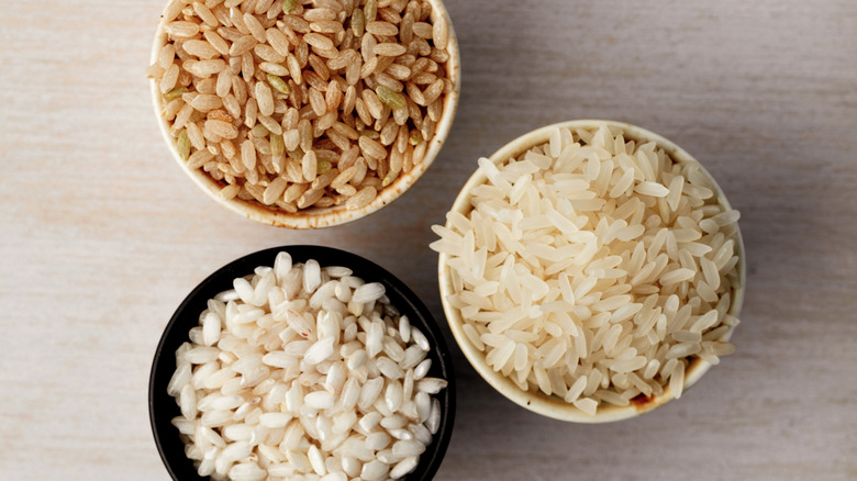 three small bowls of different kinds of rice
