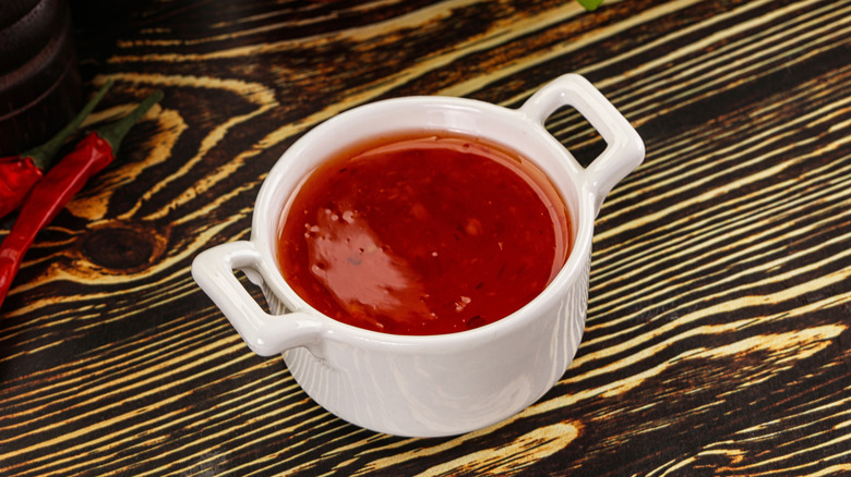 red dipping sauce in white bowl