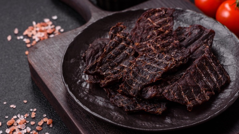 A plate of dark beef jerky