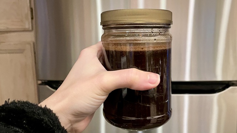 Cold brew coffee in hand